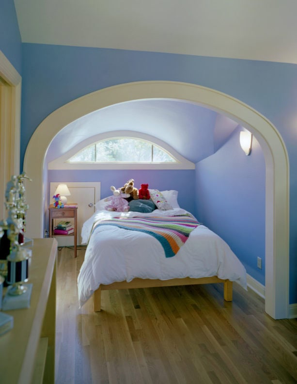 inspiration for a girl’s attic bedroom with bright decoration and blue slanted walls