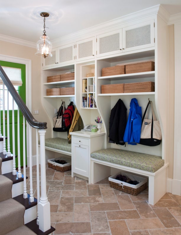 elegant foyer as a small entryway with travertine tile flooring