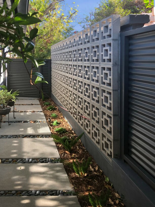 corrugated metal mid-century modern fence paired with breeze block wall