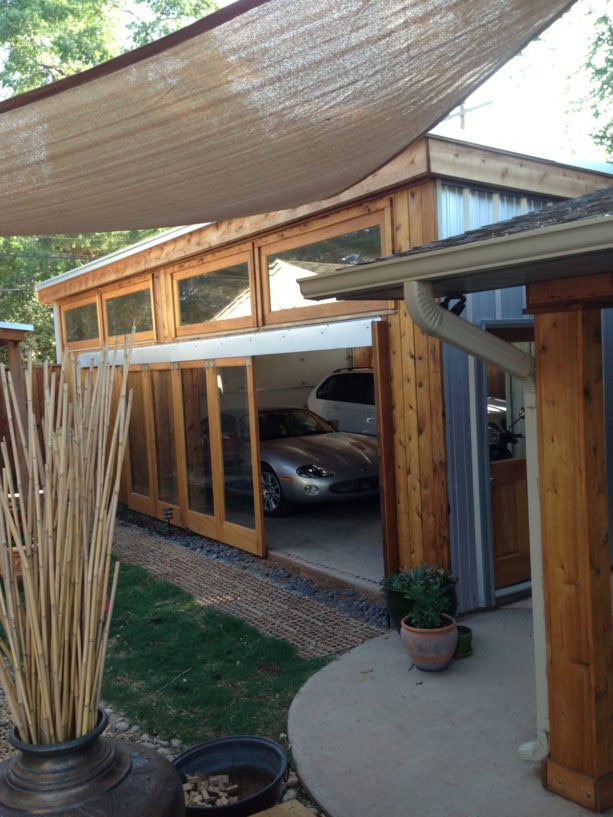 full glass panel side sliding door in a rustic garage