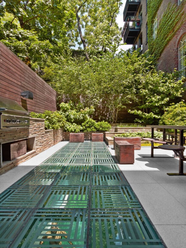 minimalist townhouse patio with an outdoor dining space and grill floor