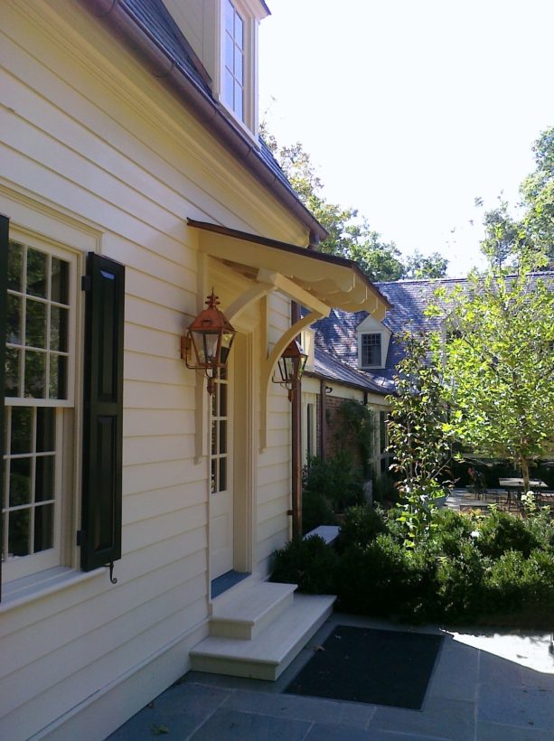 timber door awning in an arts and crafts entrance