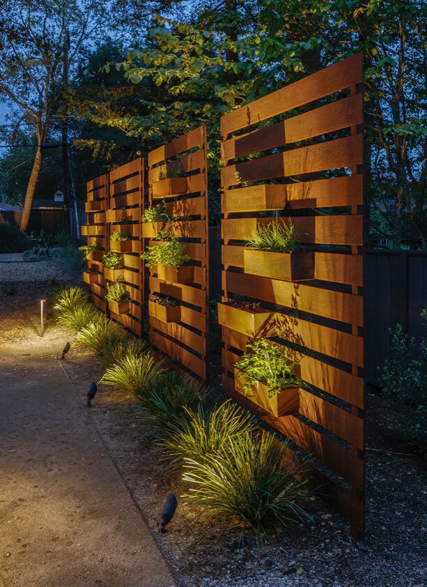 weathered steel panel mid-century modern fence with flower boxes