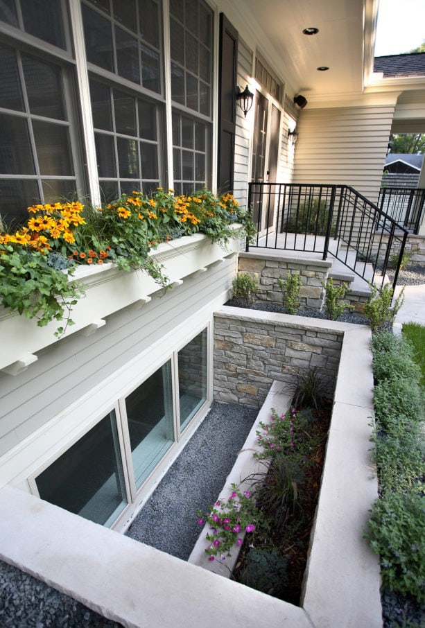 extra wide stone basement window well