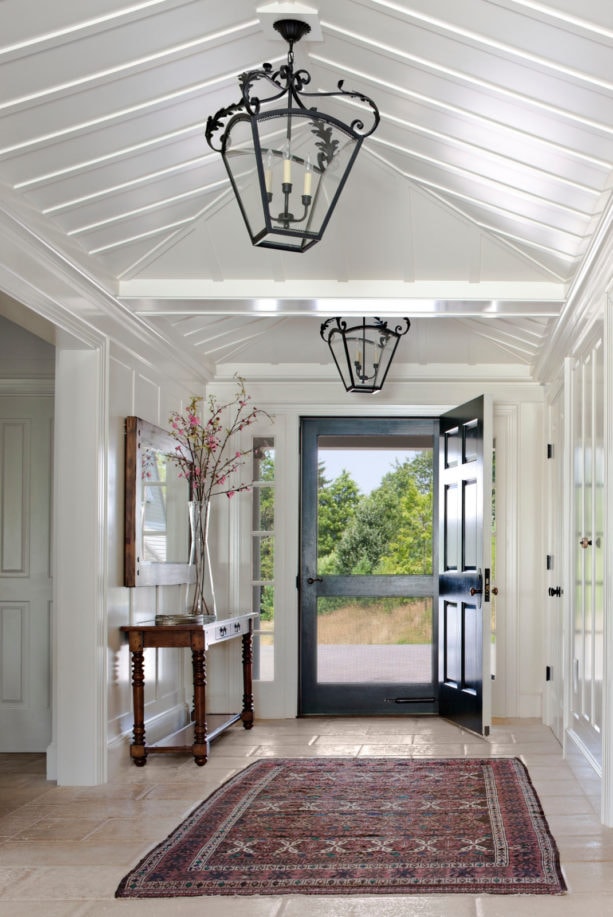 country style small entryway with beige tile flooring