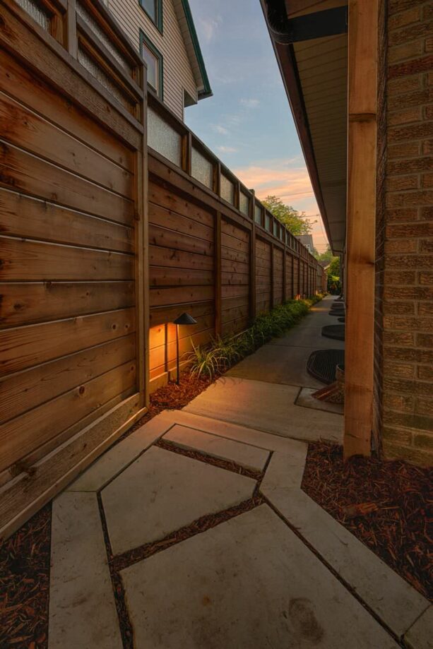 mid-century modern tall cedar fence with a safety glass panel at the top