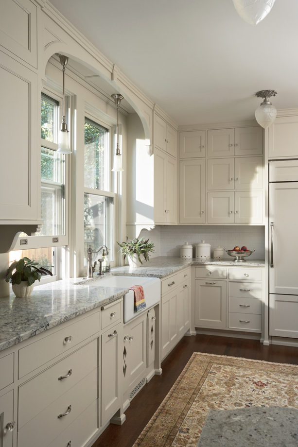 victorian kitchen with double hung windows over a farmhouse sink