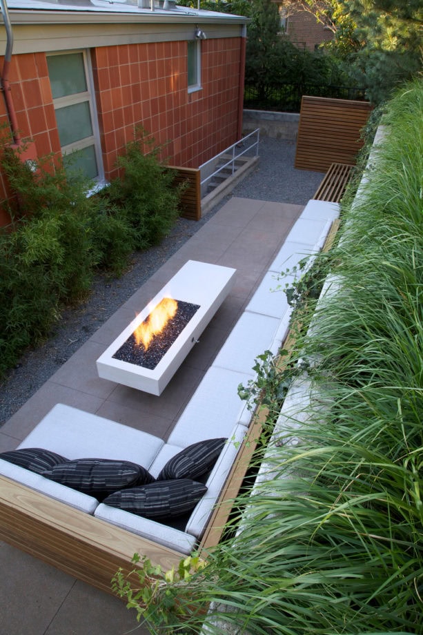 classic long patio in a small backyard paved with concrete