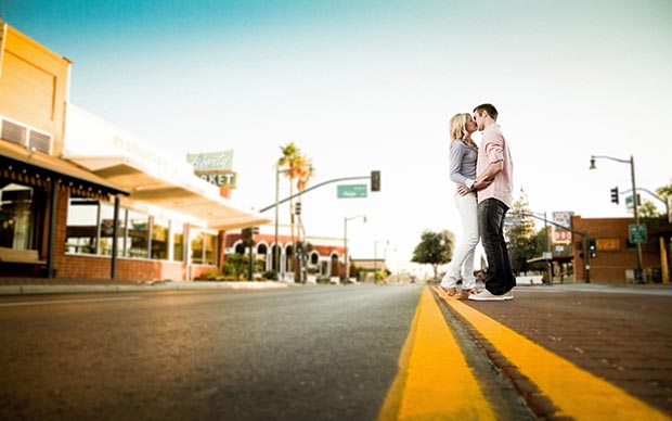 in-love couple kiss on the road