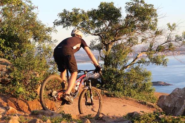 Mountain biker staying under control as he navigates a downhill trail