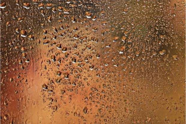 Wet glass after bike rider was cycling in the rain with glasses