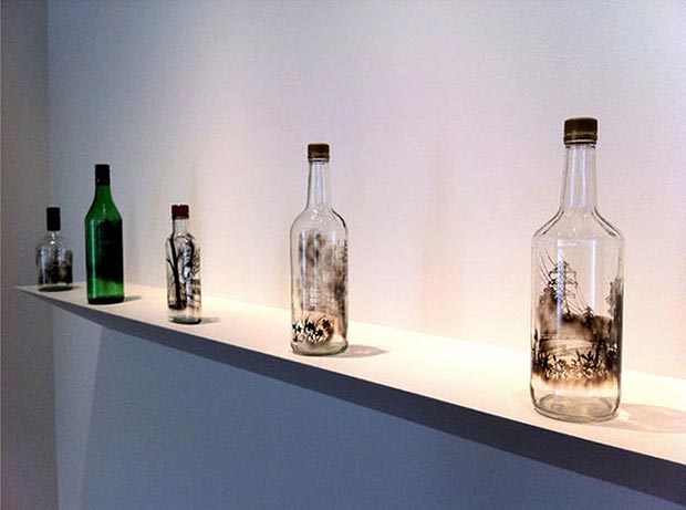 Smoke paintings on the bottle by Jim Dingilian 