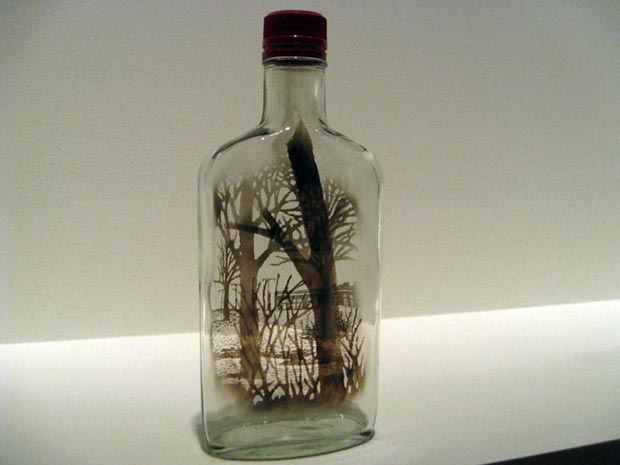 Smoke paintings on the bottle by Jim Dingilian 