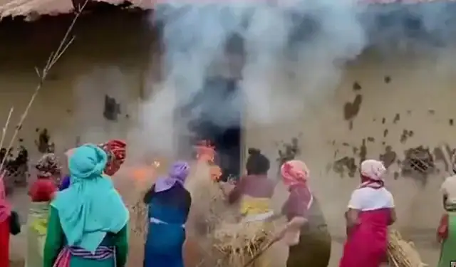 Women put burning hays in house of the accused in viral Manipur video case, in Pechi Awang Leikai, Manipur, India, July 20, 2023, in this screengrab obtained from a Handout video. ANI/via REUTERS INDIA OUT. NO COMMERCIAL OR EDITORIAL SALES IN INDIA. THIS IMAGE HAS BEEN SUPPLIED BY A THIRD PARTY.
ANI via REUTERS