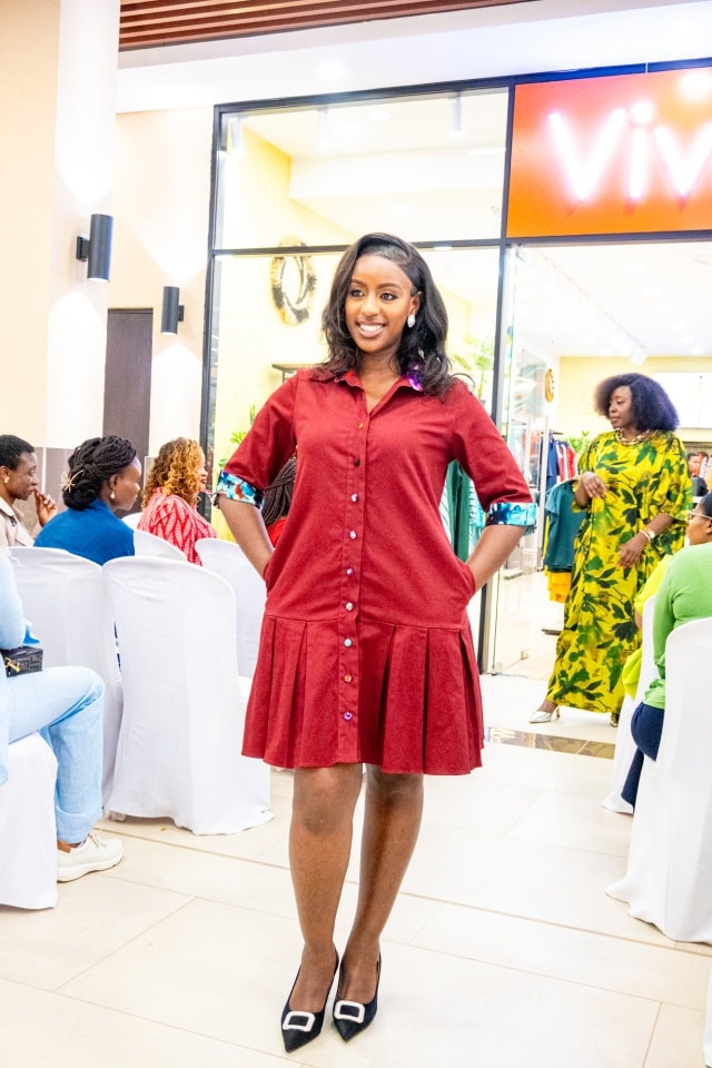 A woman models a red shirt dress during the Style, Shop & Sip fashion event.