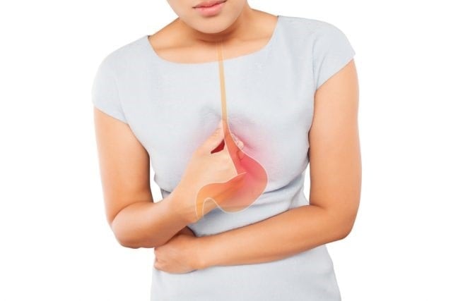 A woman has heartburn