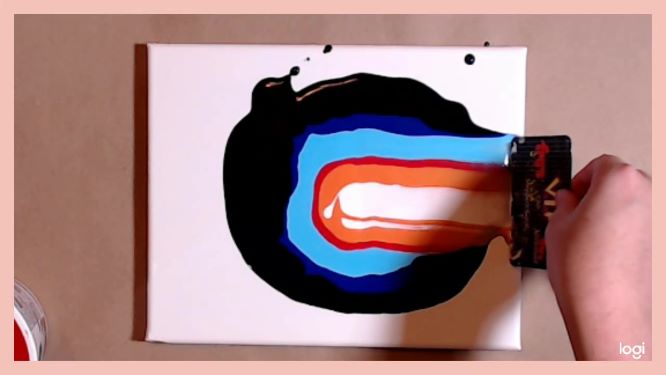 acrylic pour starburst in progress