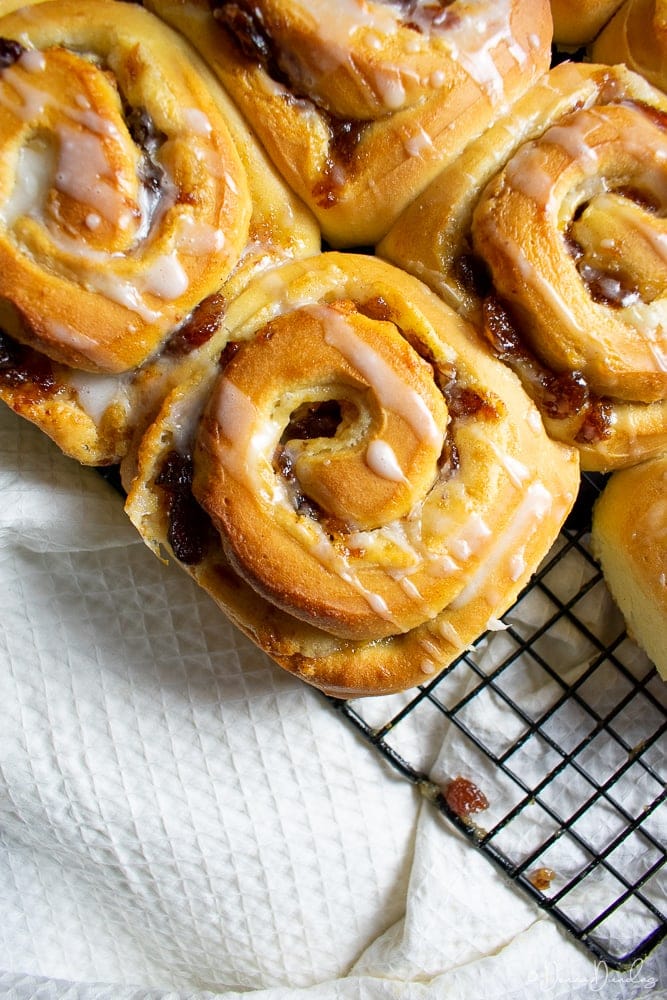 top view of mincemeat Chelsea buns on wire rack