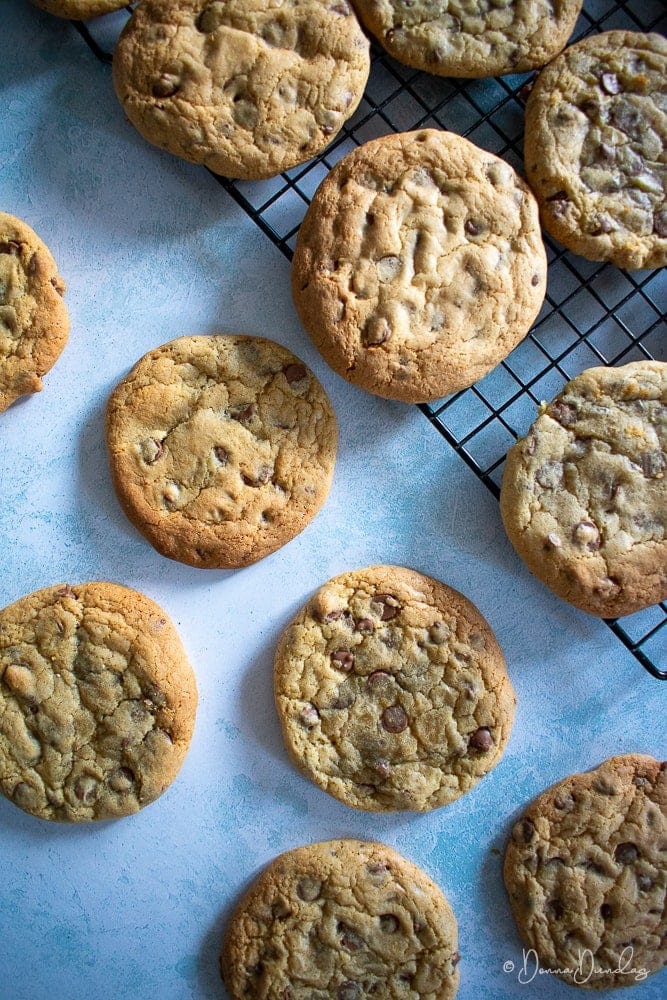 cookies on wire rack, more on table to the side