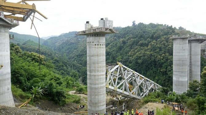 Rescue workers at the site of an under-construction railway bridge collapse near Sairang, Aizwal district, Mizoram state, India, Aug. 23, 2023. (AFP)