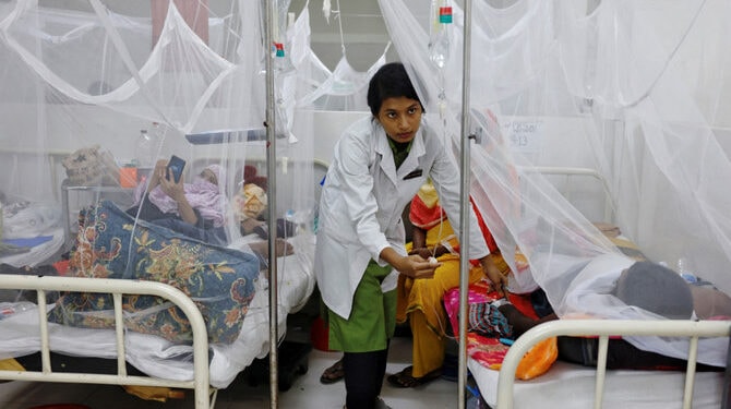 In this file photo, a nurse provides treatment to a dengue-infected patient at the Shaheed Suhrawardy Medical College and Hospital in Dhaka, Bangladesh on July 26, 2023. (Reuters)