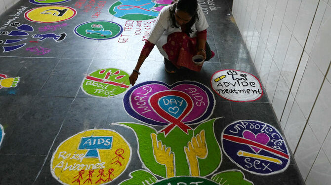 Above, a medical staff makes a rangoli designs at an anti-retroviral therapy center which provides care and support to people with HIV/AIDS at the government-run Gandhi Hospital in Hyderabad on Dec. 1, 2023, on the occasion of World AIDS Day. (AFP)