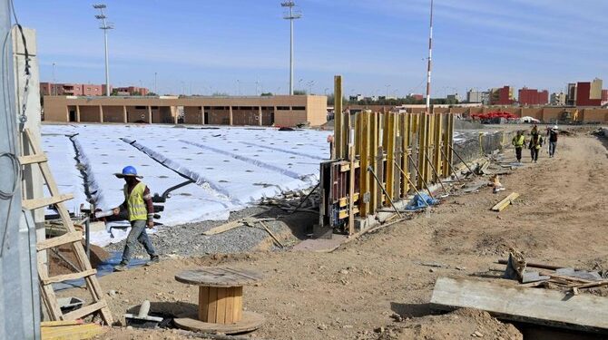 Construction workers are seen at work at the Marrakech Stadium in the Moroccan capital on Dec. 5, 2024, ahead of the 2025 African Cup of Nations, and as part of a plan to upgrade a number of stadiums in preparation for co-hosting the 2030 FIFA World Cup. (AFP)