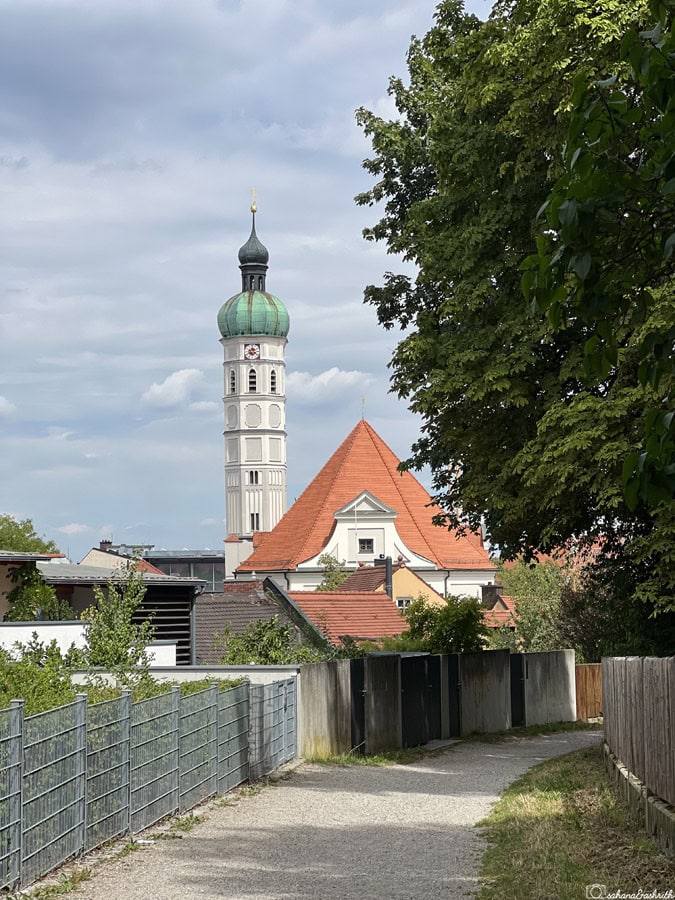 a church in Germany with onion dome and conical roof