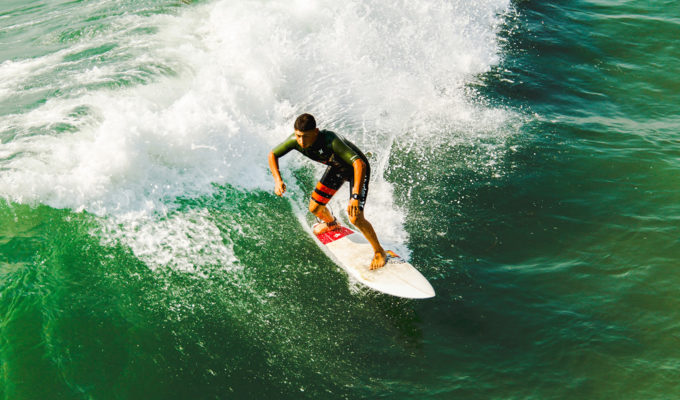 Surfboards are thinner and more maneuverable than SUPs when comparing surfboards with paddle boards