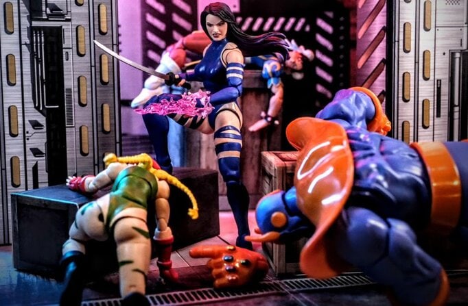Psylocke defeats Thanos in an epic Marvel Legends Gamerverse action figure battle, surrounded by fallen characters