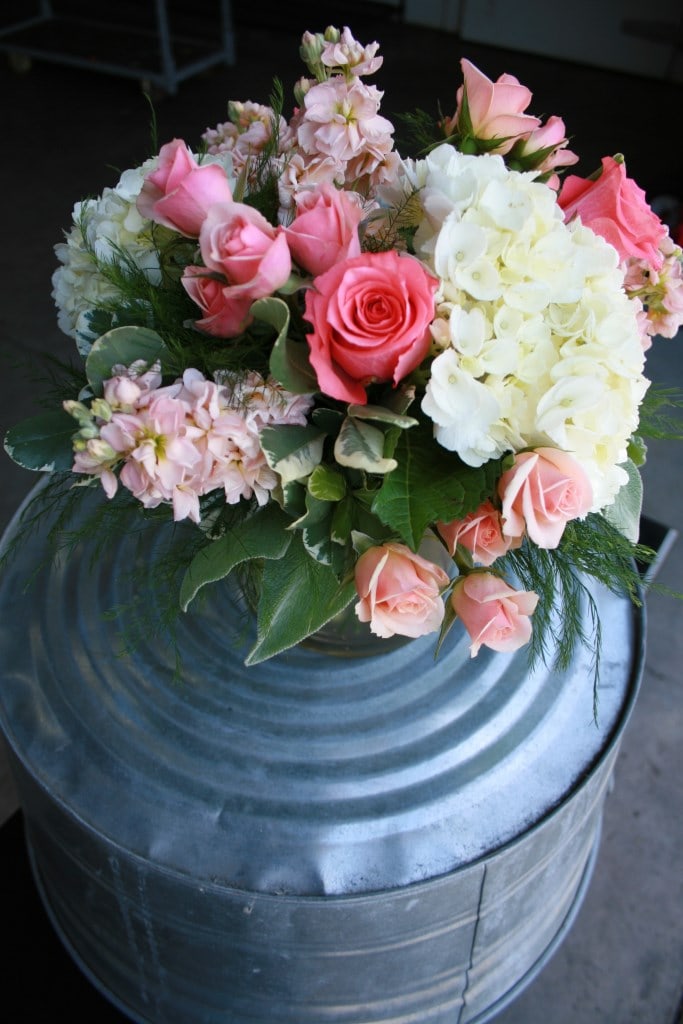 Coral, peach, and ivory centerpiece. Centerpiece and Aisle floral arrangement.