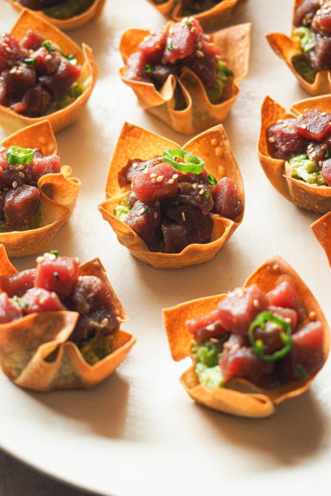 Crunchy Tuna Tartare Wonton Cups to impress your family and friends with an appetiser. They're restaurant worthy with their crunchy wonton base stuffed with an avocado mash and topped with a delicious tuna tartare. They're not only mouthwatering but also incredibly easy to make. | Paula's Apron Recipe