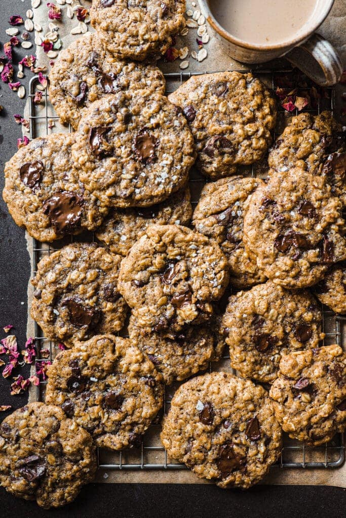 These Brown Butter Oatmeal Chocolate Chip Cookies are a delicious twist on the classic chocolate chip cookies. The touch of oats adds texture and what makes them even more amazing is the addition of brown butter, its nutty aroma takes these cookies to the next level. They are crispy on the outside and chewy in the middle, with plenty of chocolate. I personally love them with a final touch of flaky sea salt for that sweet-salty contrast. | Paula's Apron Recipe