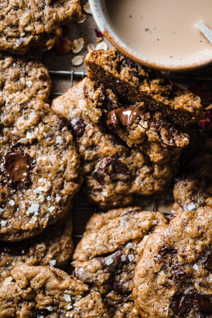 These Brown Butter Oatmeal Chocolate Chip Cookies are a delicious twist on the classic chocolate chip cookies. The touch of oats adds texture and what makes them even more amazing is the addition of brown butter, its nutty aroma takes these cookies to the next level. They are crispy on the outside and chewy in the middle, with plenty of chocolate. I personally love them with a final touch of flaky sea salt for that sweet-salty contrast. | Paula's Apron Recipe