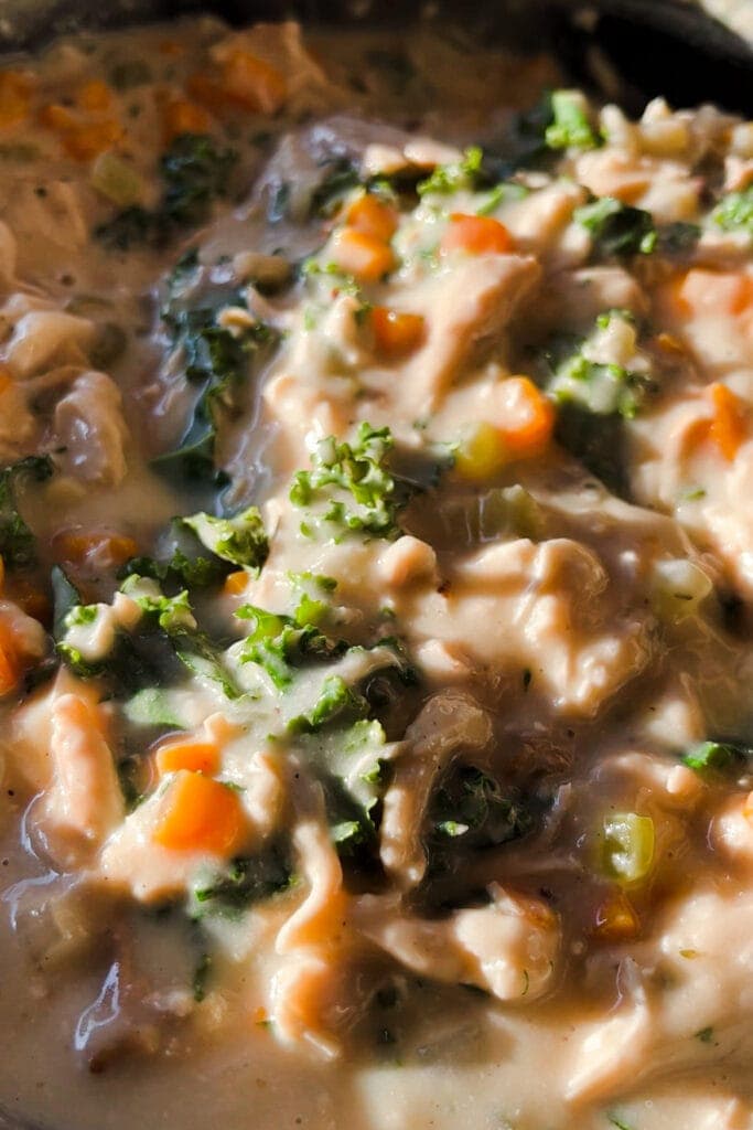 Vegetable (celery, carrot, onion, garlic and kale) and chicken filling with broth, milk, herbs, salt and black pepper for an Easy and Nutritious Chicken Pot Pie. | Paula's Apron Recipe