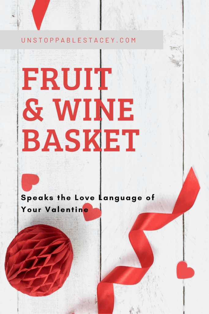 pinterest post with red text reading " Fruit & Wine Basket " red hearts and ribbon decorate the design