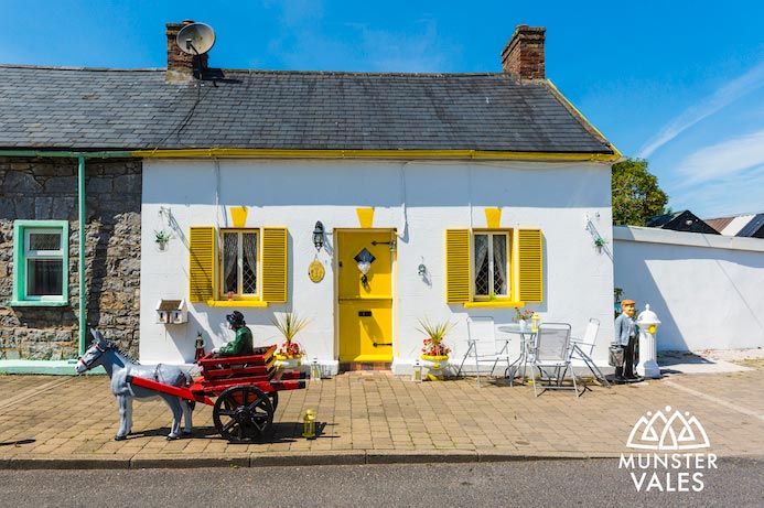 Munster Vales Ireland Travel Guide. Photograph of traditional Irish cottage.