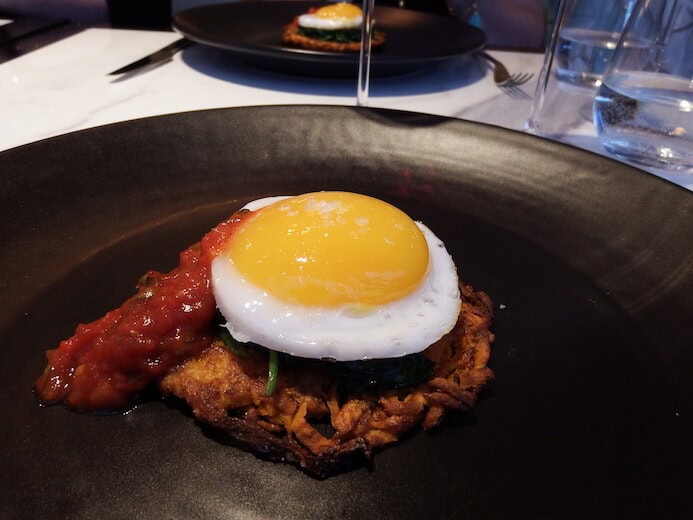 Non-veggies would love this plate of simple, yet elegant fried duck egg, sweet potato rosti wilted spinach and tomato cilantro sauce from the Coburg in the Conrad Hotel in Dublin