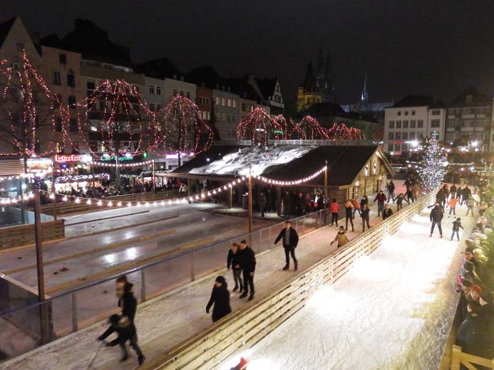 Cologne Christmas Markets Guide Old Christmas market in Cologne Germany ice-rink and ice skaters