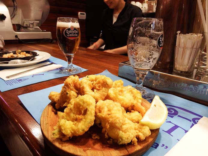 La Boqueria Food Market in Barcelona tapas of calamari