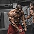 Bodybuilding Motivation. Two Bodybuilders Train Together at the Gym