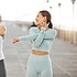 Fitness friends, exercise and wellness with two women stretching and warming up for their workout a