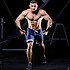 Male handsome bodybuilder gaining muscles in the gym