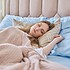 Sleeping young woman, healthy daytime sleep, on pillow with closed eyes