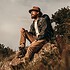 Relaxed thoughtful male traveler enjoying natural landscape