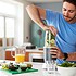 Man Making Healthy Juice Drink With Fresh Ingredients In Electric Juicer After Exercise