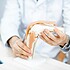 Therapist showing knee joint model