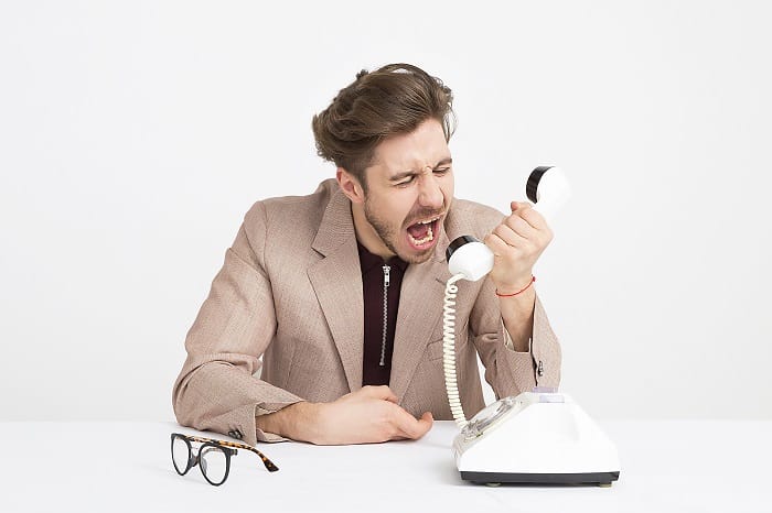 crossing boundaries man shouting down telephone
