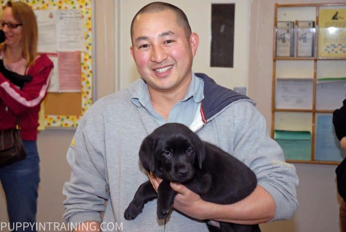 Me and Stetson, 8 week old black lab puppy in training