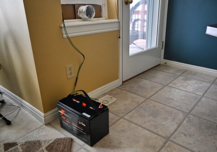 lithium battery powering a portable diesel heater bing used for emergency home heating